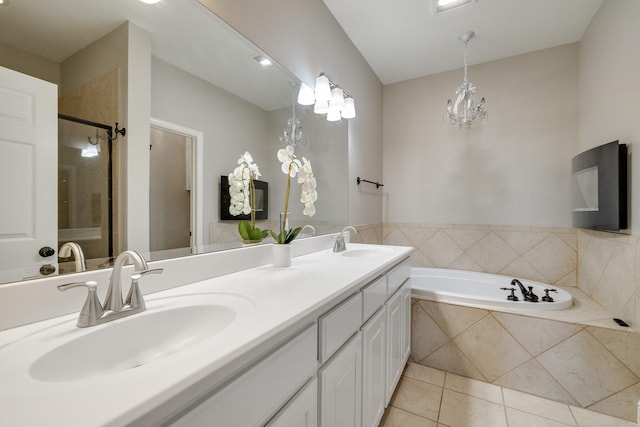 bathroom featuring tile patterned flooring, vanity, plus walk in shower, and a notable chandelier