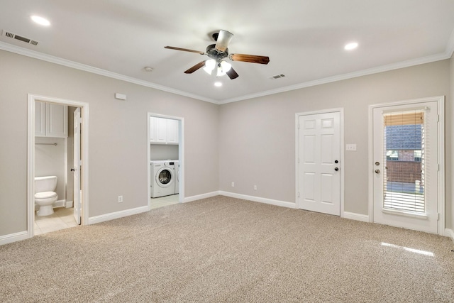 interior space with washer / dryer, visible vents, ornamental molding, and light colored carpet