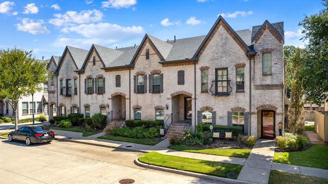 view of front of property featuring brick siding