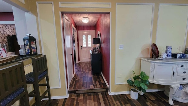 corridor with dark wood-type flooring