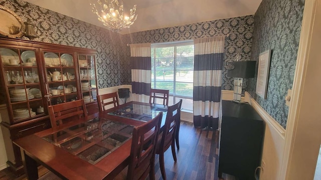 dining space with a chandelier and dark hardwood / wood-style floors