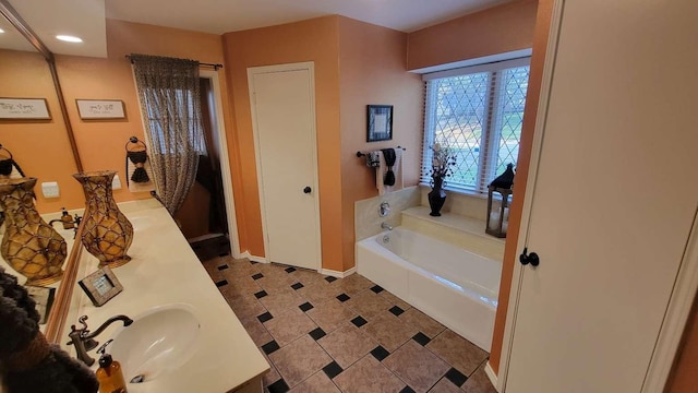 bathroom with a bathing tub and vanity