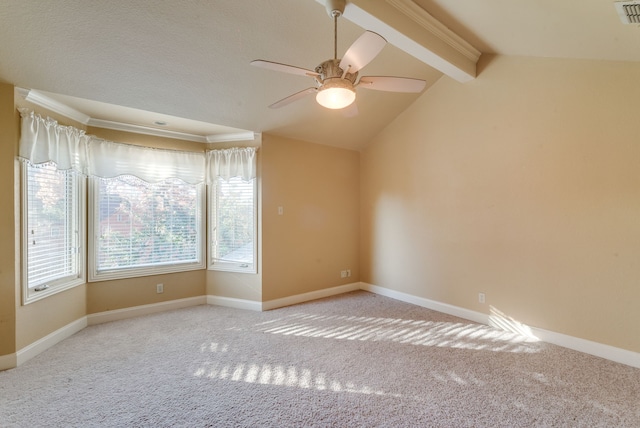 carpeted empty room with crown molding, lofted ceiling with beams, and ceiling fan