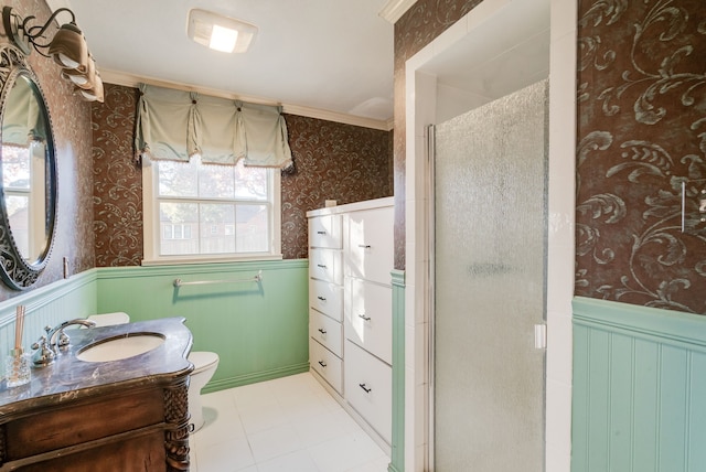 bathroom with ornamental molding, vanity, toilet, and an enclosed shower