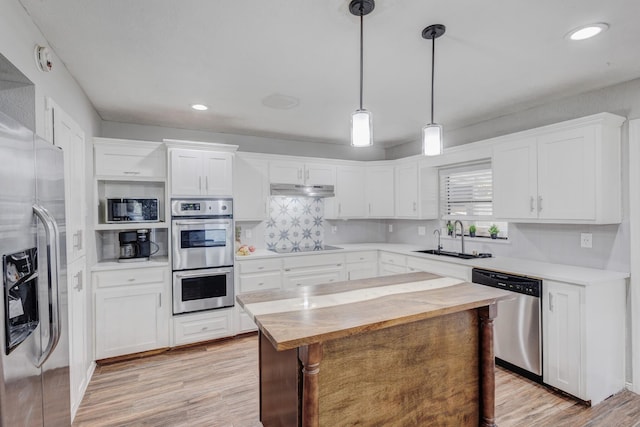 kitchen featuring white cabinets, sink, and appliances with stainless steel finishes