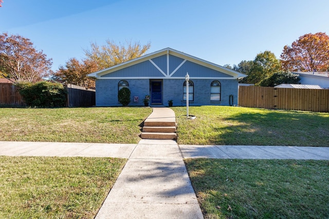 single story home with a front yard