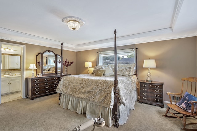 carpeted bedroom featuring ensuite bathroom and ornamental molding