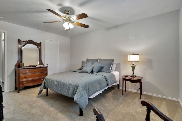 bedroom featuring ceiling fan and light colored carpet