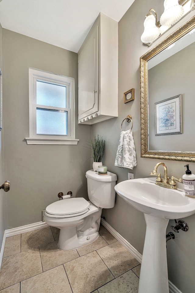 bathroom featuring tile patterned floors and toilet