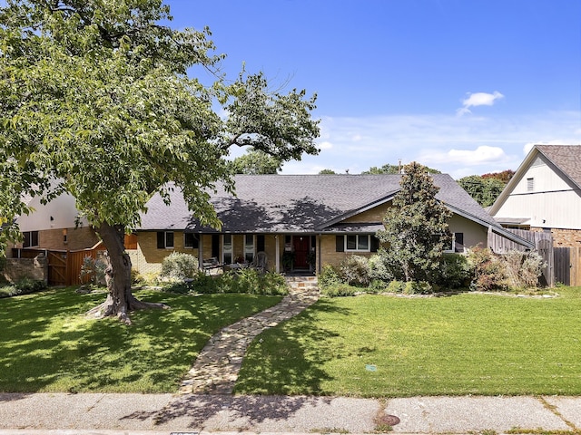 single story home with a front yard