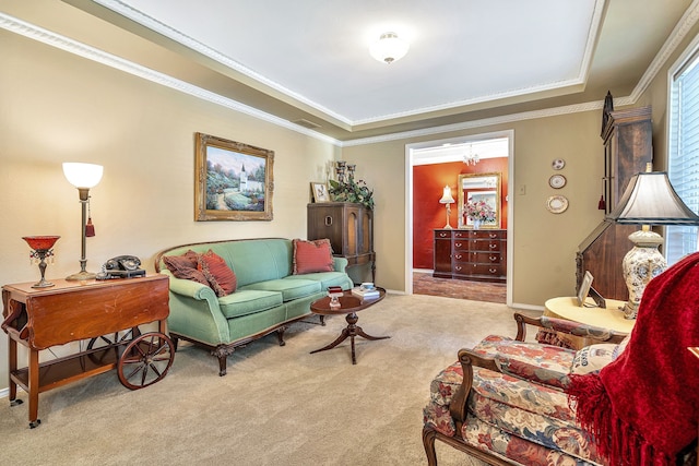 carpeted living room with a raised ceiling and crown molding