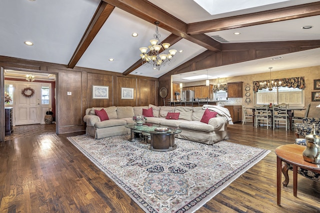 living room featuring a notable chandelier, lofted ceiling with beams, dark wood-type flooring, and wooden walls