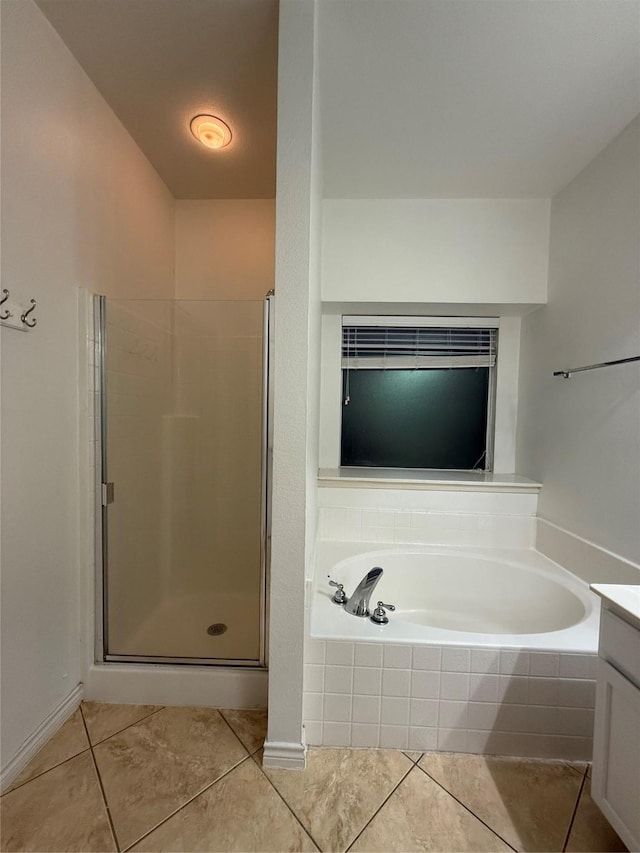 bathroom with vanity, tile patterned floors, and independent shower and bath