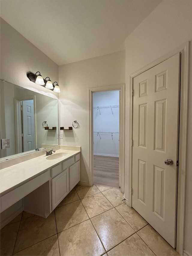 bathroom with vanity and tile patterned floors