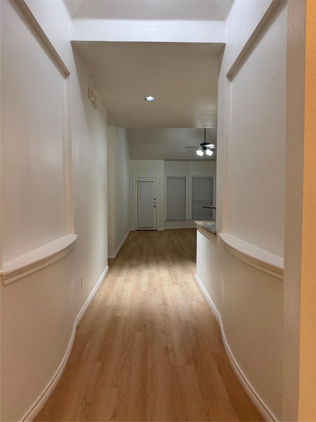 corridor featuring light hardwood / wood-style flooring