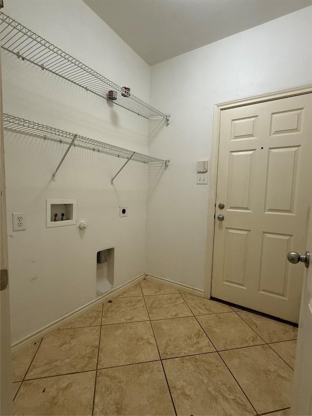 laundry room featuring gas dryer hookup, washer hookup, hookup for an electric dryer, and light tile patterned floors