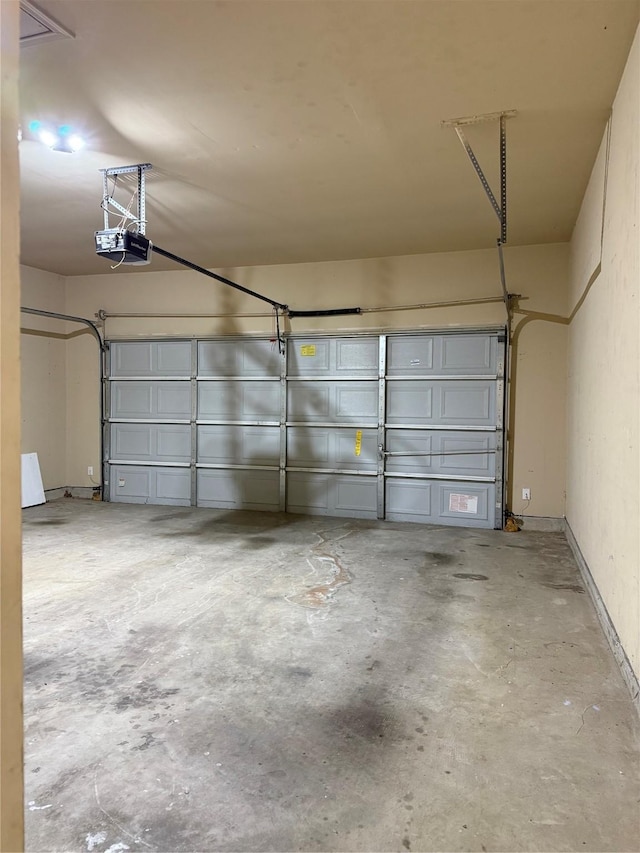 garage featuring a garage door opener