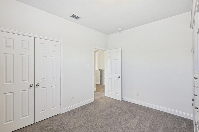 full bathroom with vanity, tiled shower / bath, lofted ceiling, and toilet