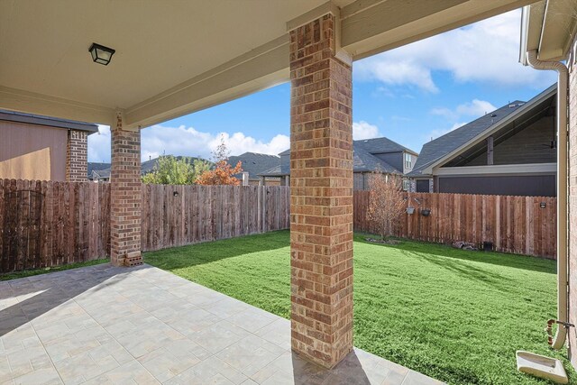 doorway to property featuring a patio area and a yard