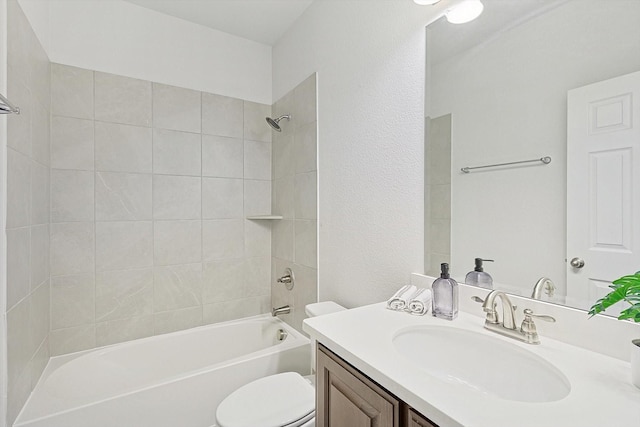 full bathroom with washtub / shower combination, a textured wall, vanity, and toilet