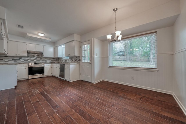 kitchen featuring white cabinets, dark hardwood / wood-style flooring, stainless steel appliances, and hanging light fixtures