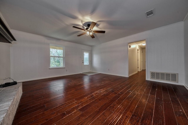 unfurnished living room featuring ceiling fan, ornamental molding, and dark wood-type flooring