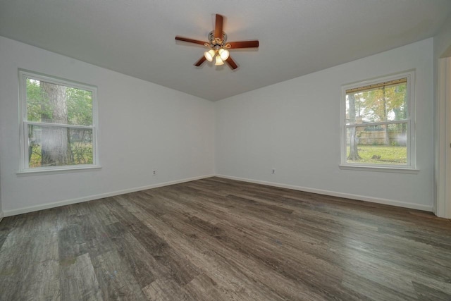 unfurnished room with dark hardwood / wood-style flooring, a wealth of natural light, and ceiling fan