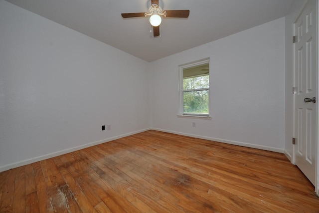 spare room with ceiling fan and light hardwood / wood-style floors