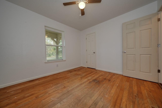 spare room featuring ceiling fan and light wood-type flooring