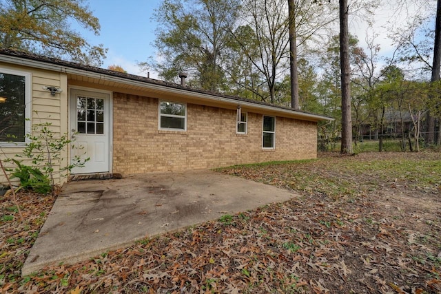 back of house with a patio