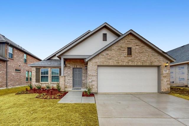 view of front of house featuring concrete driveway, brick siding, and an attached garage