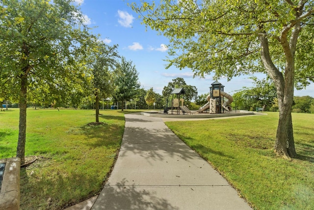 view of community with a playground and a lawn