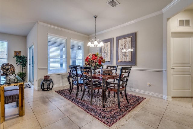 tiled dining room with crown molding, plenty of natural light, and a chandelier