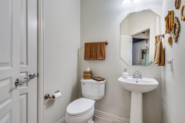 bathroom with toilet and sink