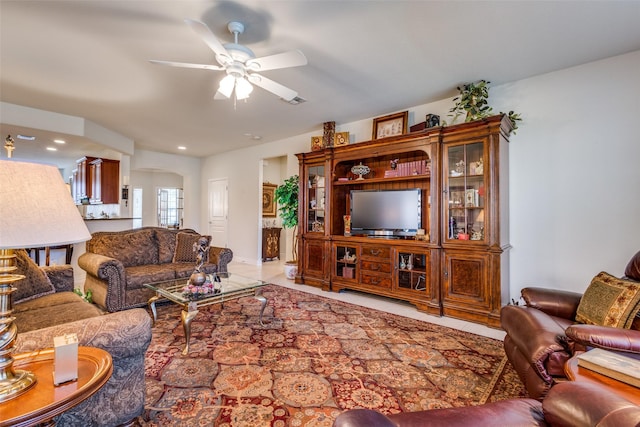 living room featuring ceiling fan and light tile patterned floors