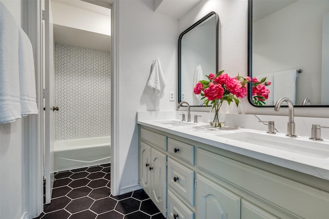 bathroom featuring tile patterned floors, vanity, and shower / bathing tub combination