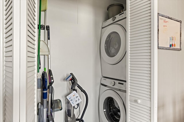 laundry room featuring stacked washing maching and dryer