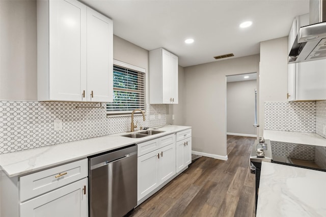 kitchen with dark wood-type flooring, sink, stainless steel dishwasher, wall chimney exhaust hood, and white cabinetry