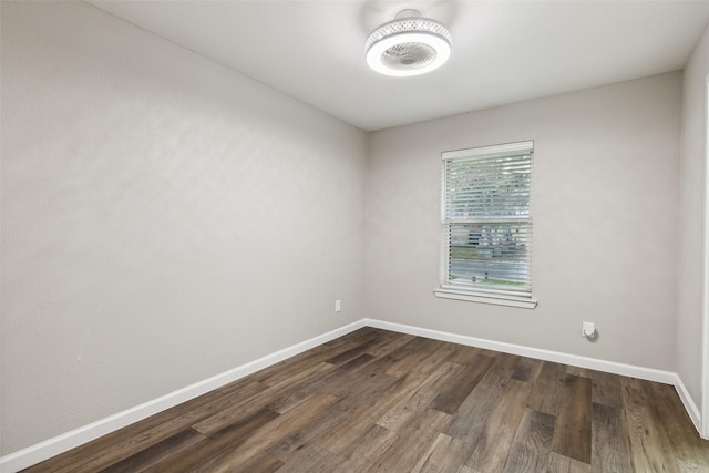 empty room with dark wood-type flooring