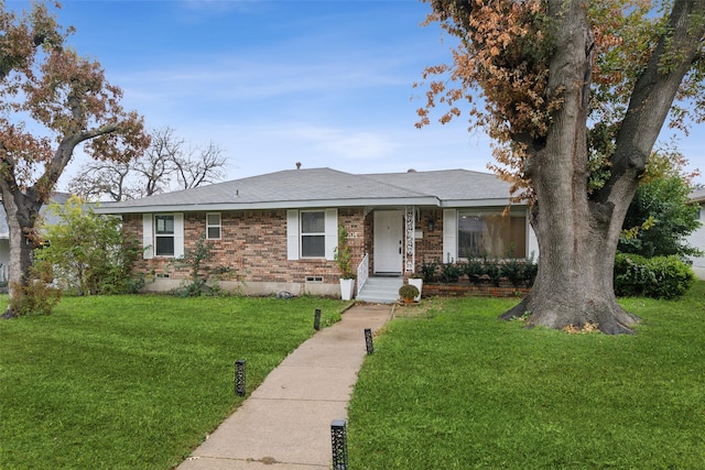 ranch-style home with a front lawn