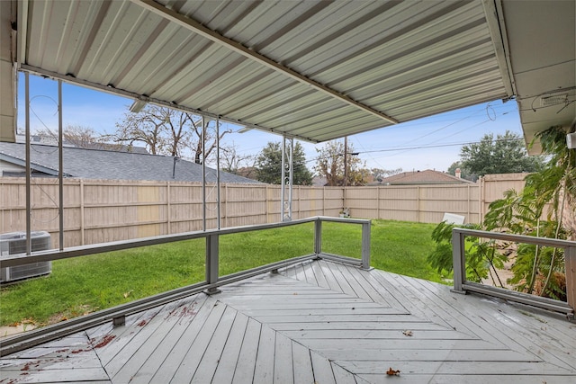 wooden deck featuring a lawn and central AC