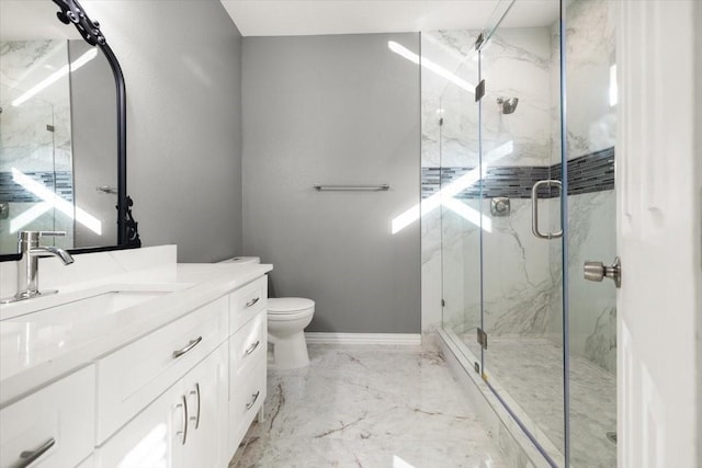 bathroom featuring vanity, toilet, and a shower with door