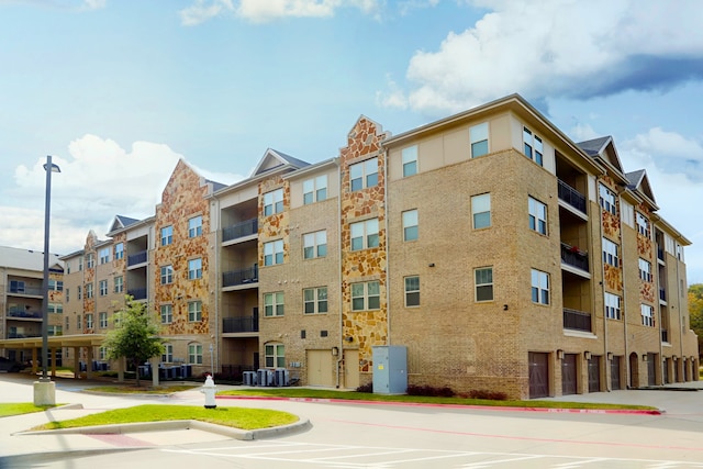 view of building exterior featuring central AC unit