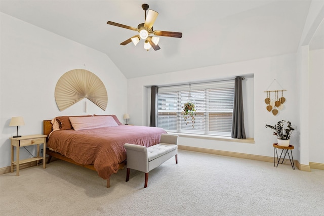 carpeted bedroom featuring ceiling fan and vaulted ceiling