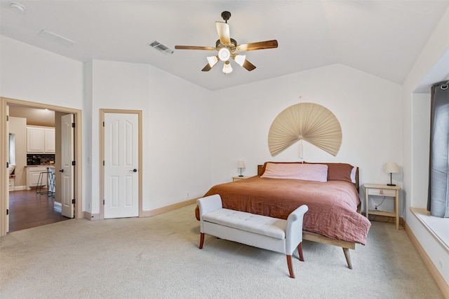 bedroom featuring carpet flooring, ceiling fan, and vaulted ceiling