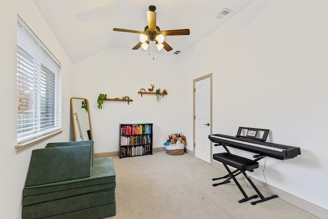 living area with ceiling fan, lofted ceiling, and carpet floors