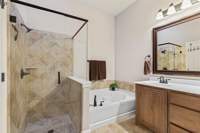 bathroom with tile patterned floors, vanity, and independent shower and bath