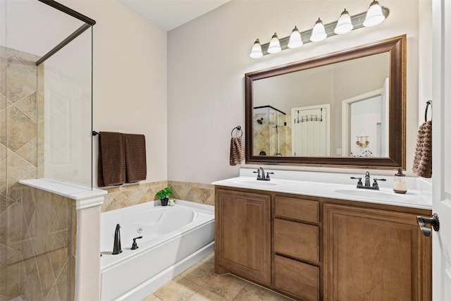 bathroom featuring tile patterned floors, vanity, and separate shower and tub