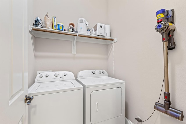 clothes washing area featuring washing machine and clothes dryer