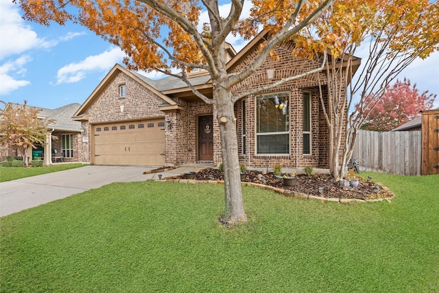 view of front of house featuring a garage and a front lawn